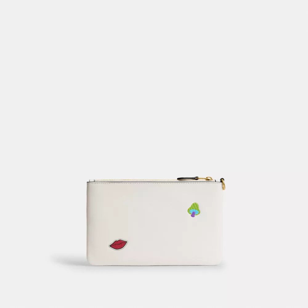 Petite pochette dragonne indispensable à imprimé autocollants
