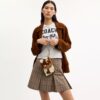 Pochette dragonne Ashton en cuir de veau velours à imprimé vache