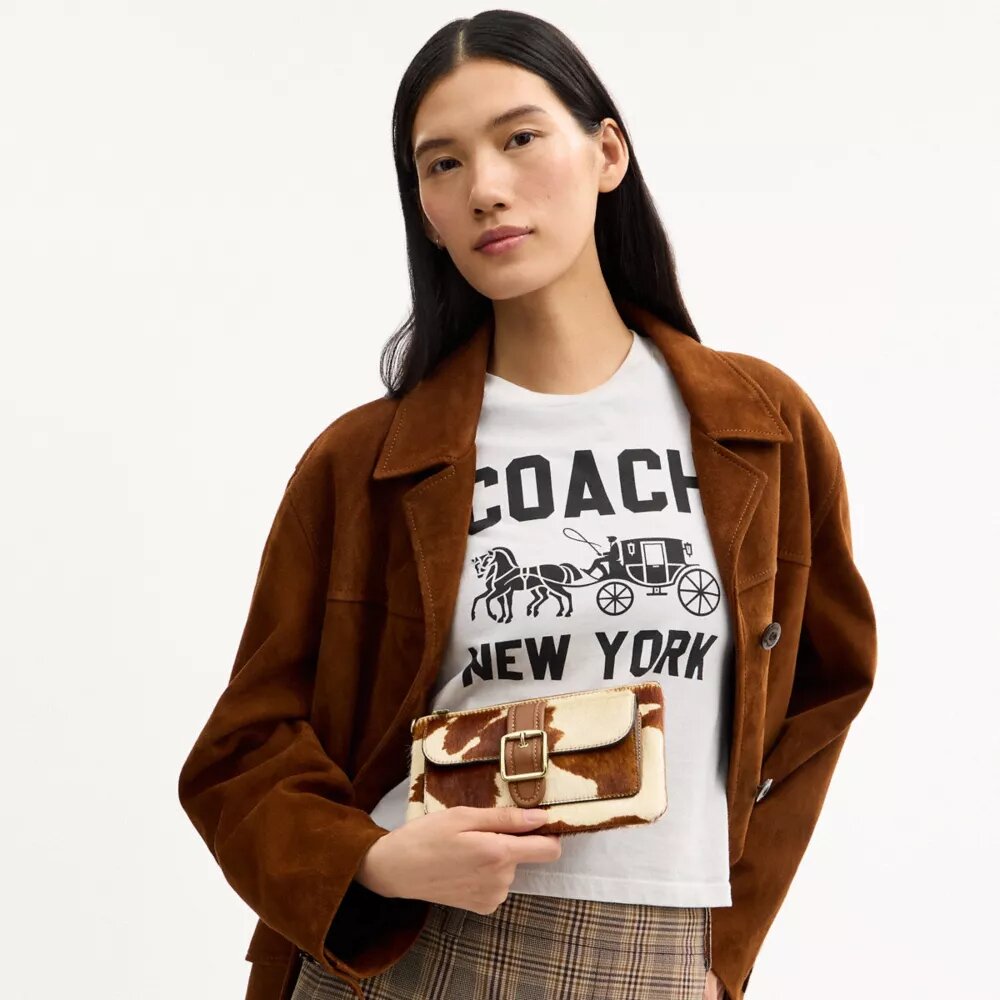 Pochette dragonne Ashton en cuir de veau velours à imprimé vache