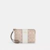 Pochette dragonne avec fermeture à glissière en coin en Signature Canvas à rayures
