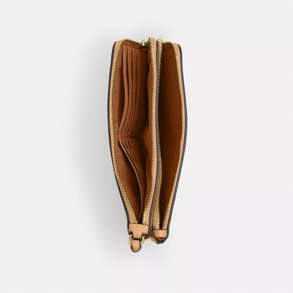 Pochette dragonne à double fermeture éclair avec imprimé floral