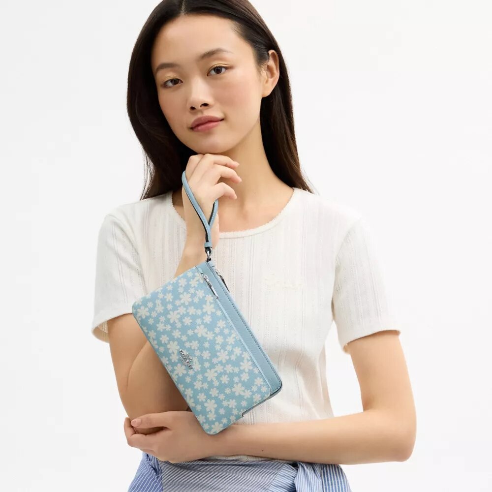 Pochette dragonne à double fermeture éclair avec imprimé floral