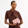 Pochette dragonne à double fermeture éclair avec imprimé floral