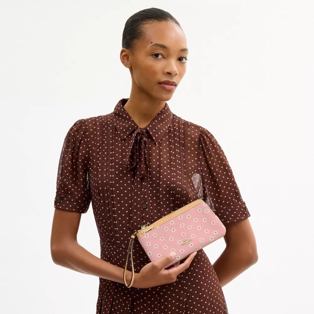 Pochette dragonne à double fermeture éclair avec imprimé floral
