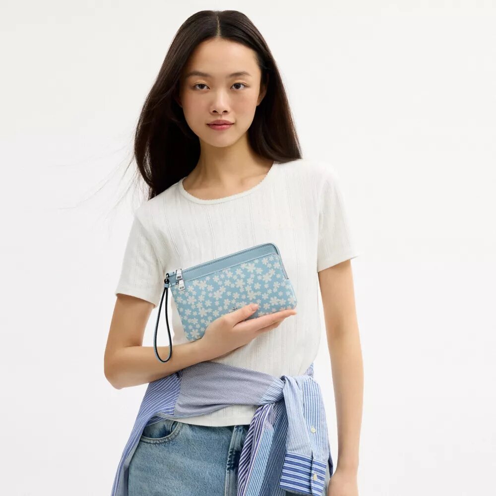 Pochette dragonne à double fermeture éclair avec imprimé floral