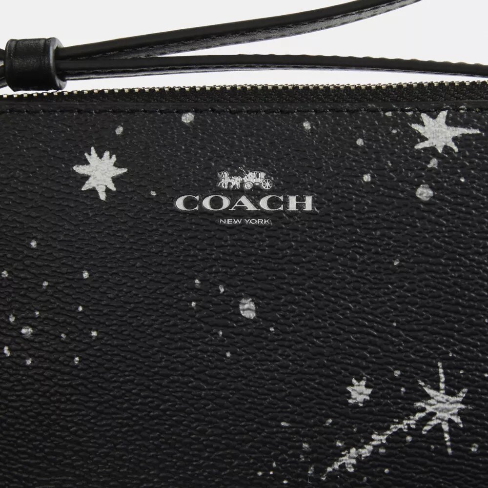 Pochette dragonne à fermeture éclair d'angle avec imprimé étoiles