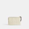 Pochette dragonne à fermeture éclair d'angle en cuir emblématique