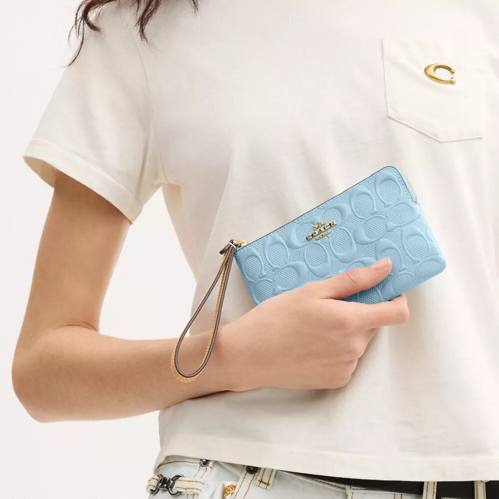 Pochette dragonne à fermeture éclair d'angle en cuir emblématique