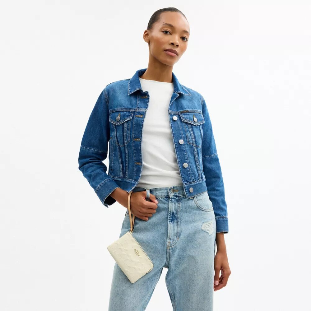 Pochette dragonne à fermeture éclair d'angle en cuir emblématique