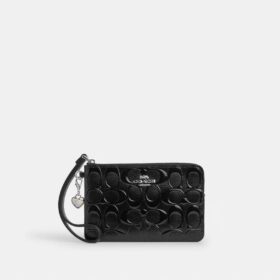 Pochette dragonne à fermeture éclair d'angle en cuir emblématique avec breloque en forme de cœur