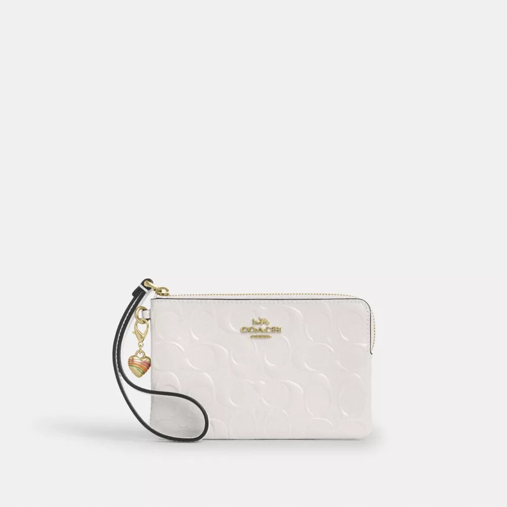 Pochette dragonne à fermeture éclair d'angle en cuir emblématique avec breloque en forme de cœur
