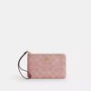 Pochette dragonne à fermeture éclair d'angle en denim emblématique