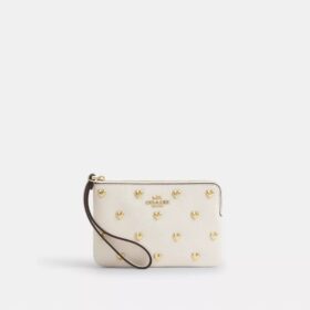 Pochette dragonne à fermeture éclair dans le coin avec rivets en forme de cœur