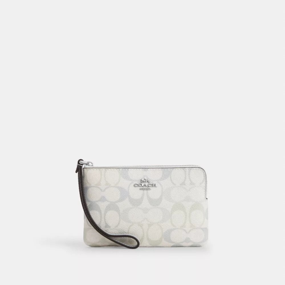 Pochette dragonne à fermeture éclair en Signature Canvas
