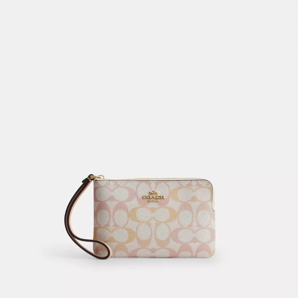Pochette dragonne à fermeture éclair en Signature Canvas