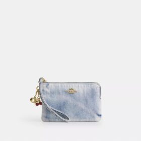 Pochette dragonne à fermeture éclair sur le côté en denim usé avec Charms
