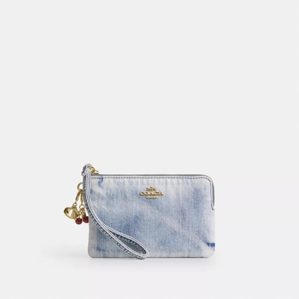 Pochette dragonne à fermeture éclair sur le côté en denim usé avec Charms