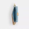 Pochettes dragonne Ashton en cuir Signature