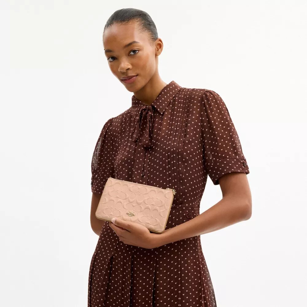 Pochettes dragonne Ashton en cuir Signature