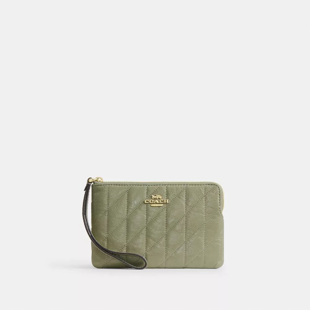 Pochettes dragonne avec fermeture à glissière dans le coin et matelassage