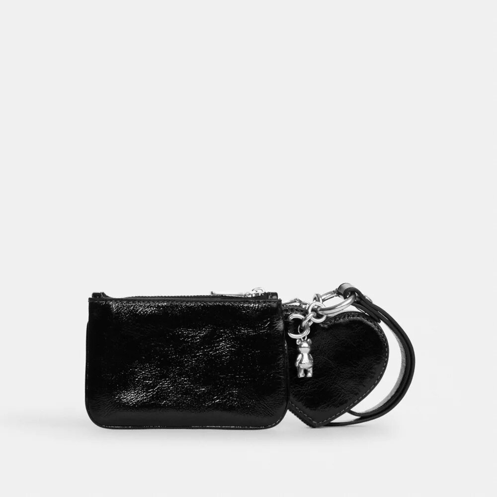 Pochettes dragonne et pochette en forme de cœur avec Charms