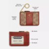 Porte-carte d’identité Essential Mini en Signature Canvas