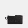 Porte-cartes à fermeture éclair avec motif Coach