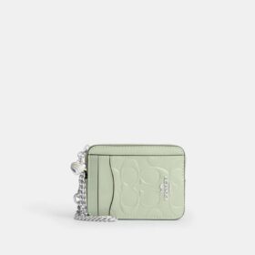 Porte-cartes à fermeture éclair en cuir emblématique avec breloque en forme de cœur