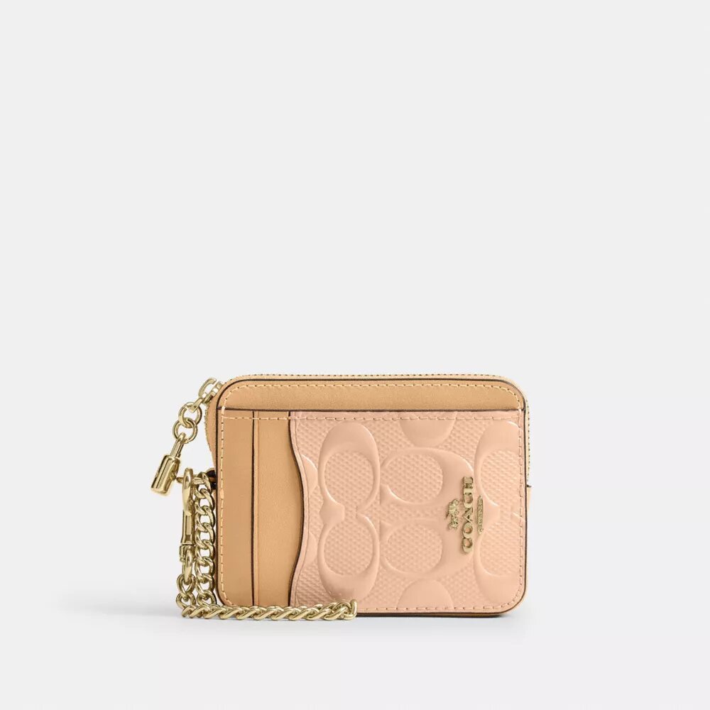 Porte-cartes à fermeture éclair en cuir signature avec Charms