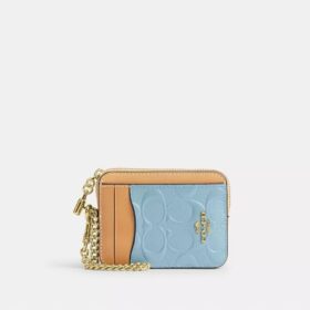 Porte-cartes à fermeture éclair en cuir signature avec Charms