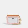 Porte-cartes à fermeture éclair en Signature Canvas avec Charms