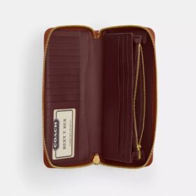 Portefeuille Continental incontournable en Signature Canvas