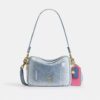 Sac à bandoulière Carey en denim « Loved » avec Charms
