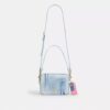 Sac à bandoulière Carey en denim « Loved » avec Charms