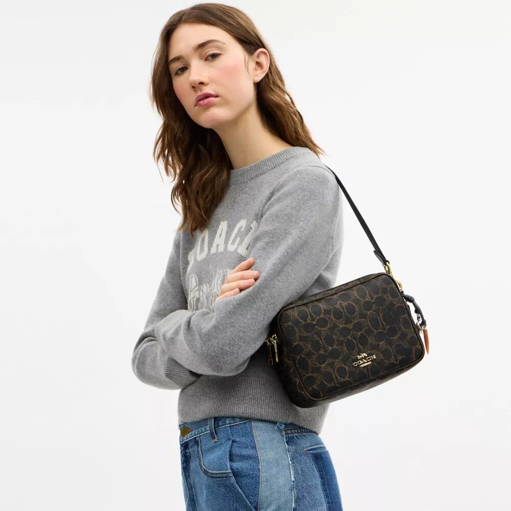 Sac bandoulière Carey en Signature Canvas avec Charms
