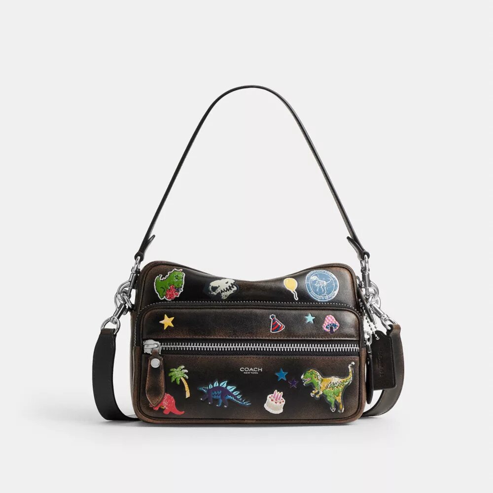 Sac bandoulière Dakota « 10e anniversaire de Rexy » en cuir patiné avec imprimé autocollants