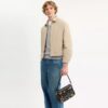 Sac bandoulière Dakota « 10e anniversaire de Rexy » en cuir patiné avec imprimé autocollants