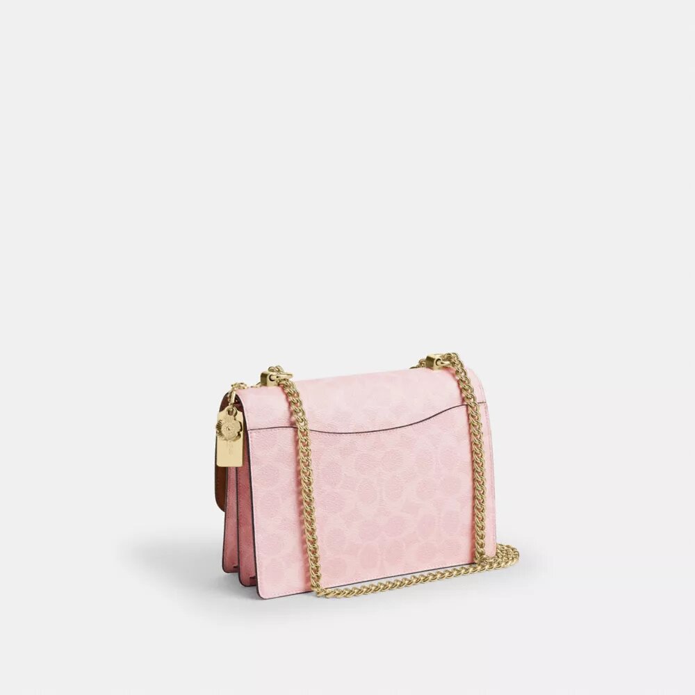 Sac à bandoulière Klare en Signature Canvas avec Charms