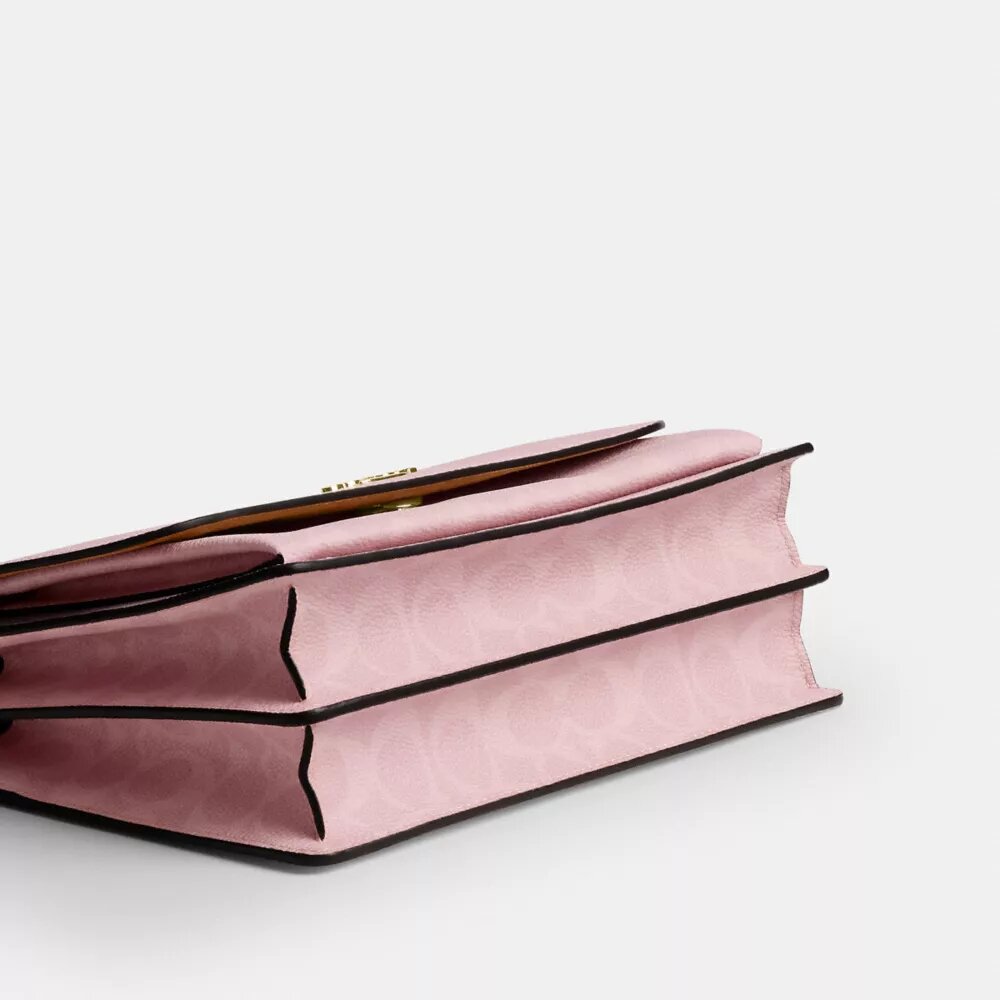 Sac à bandoulière Klare en Signature Canvas avec Charms