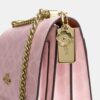 Sac à bandoulière Klare en Signature Canvas avec Charms