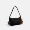 Sac à bandoulière Leo en Nylon signature avec Charms