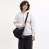 Sac à bandoulière Leo en Nylon signature avec Charms
