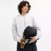 Sac à bandoulière Leo en Nylon signature avec Charms