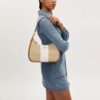 Sac hobo Teri en Signature Canvas à rayures