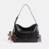 Sac messager Mott 38 en cuir patiné avec Charms