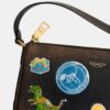 Sac « Plaza » Rexy 10e anniversaire, 18 in, en cuir patiné avec imprimé autocollants