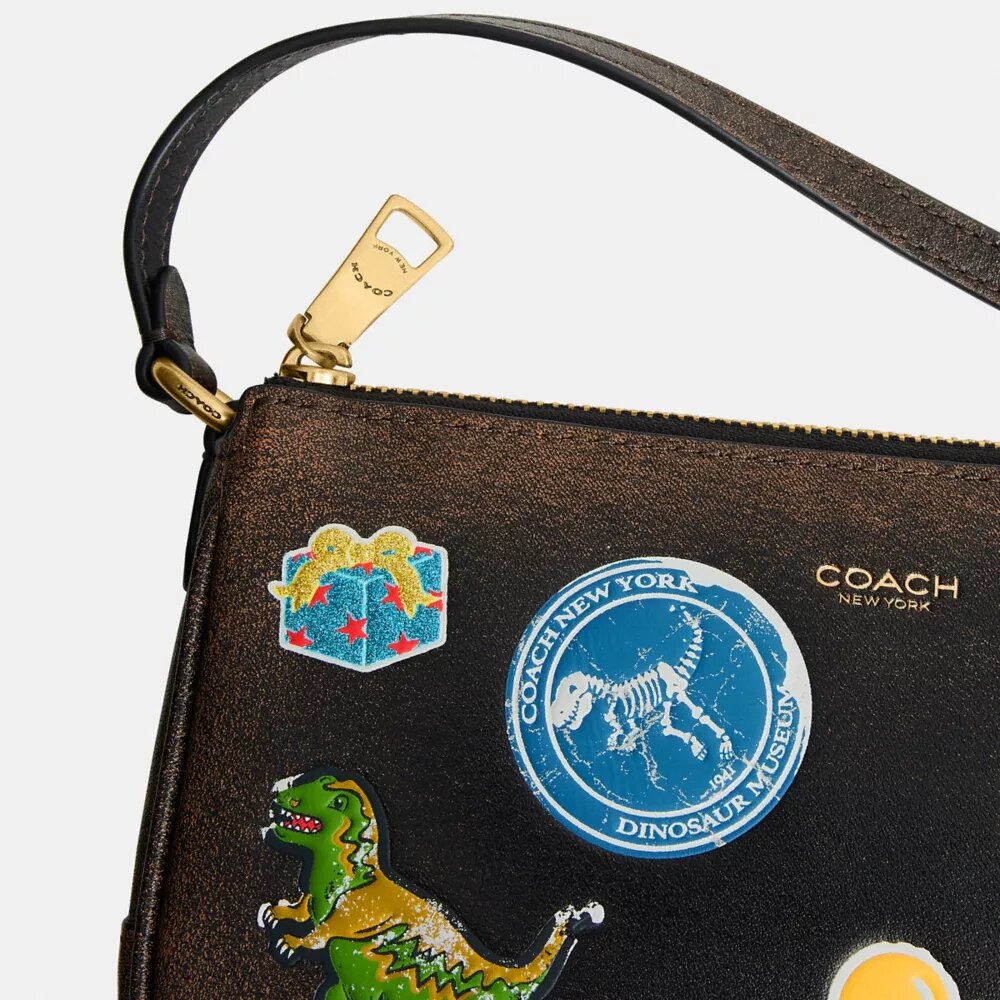 Sac « Plaza » Rexy 10e anniversaire, 18 in, en cuir patiné avec imprimé autocollants