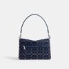 Sac porté épaule « Chain Tabby » en denim emblématique