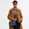 Sac porté épaule « Chain Tabby » en denim emblématique