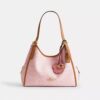Sac porté épaule Erin en Signature Canvas avec Charms